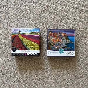 Lot of two colorful 1,000 piece puzzles of European landscapes. GUC